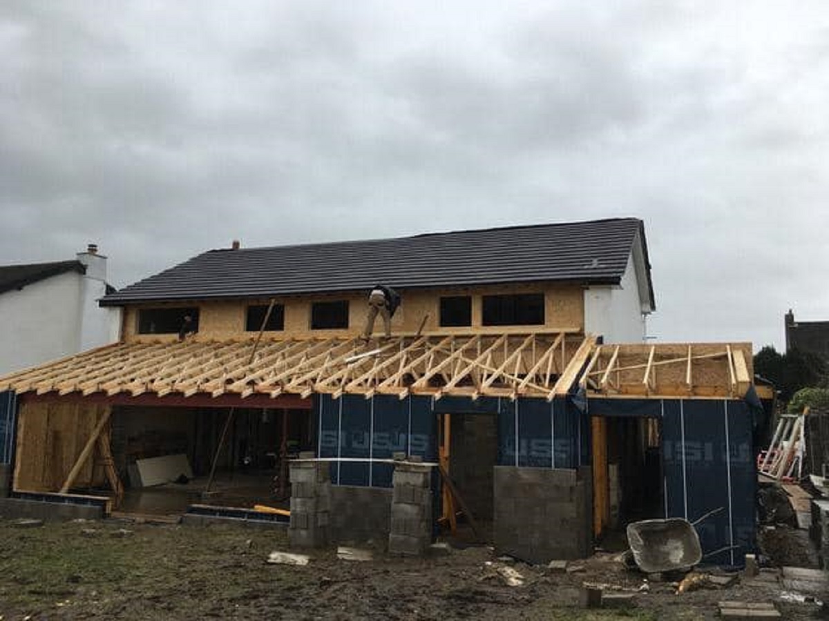 House with timber frame extension